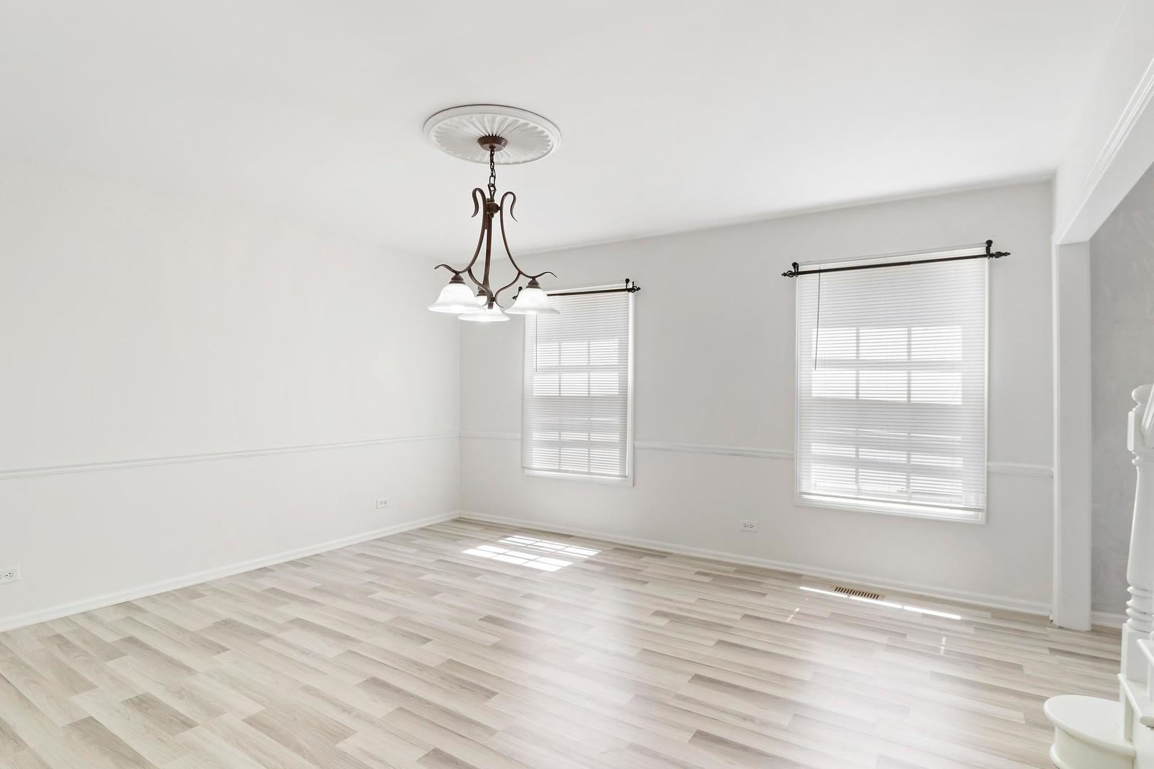 149 West Schick Road Bloomingdale, IL 60108 - Photo 15 of 35 a view of an empty room with window and wooden floor
