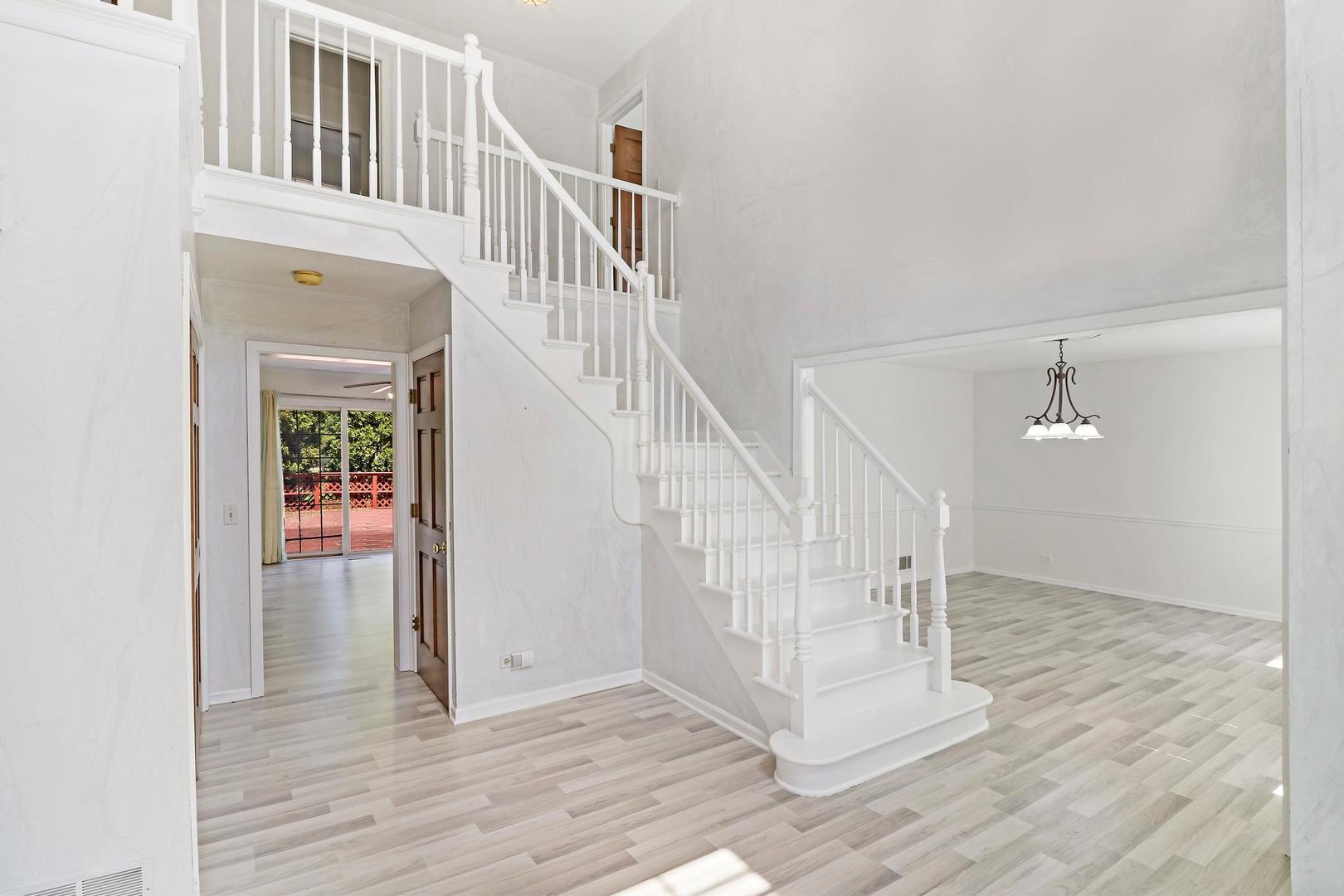149 West Schick Road Bloomingdale, IL 60108 - Photo 16 of 35 a view of entryway and hall with wooden floor