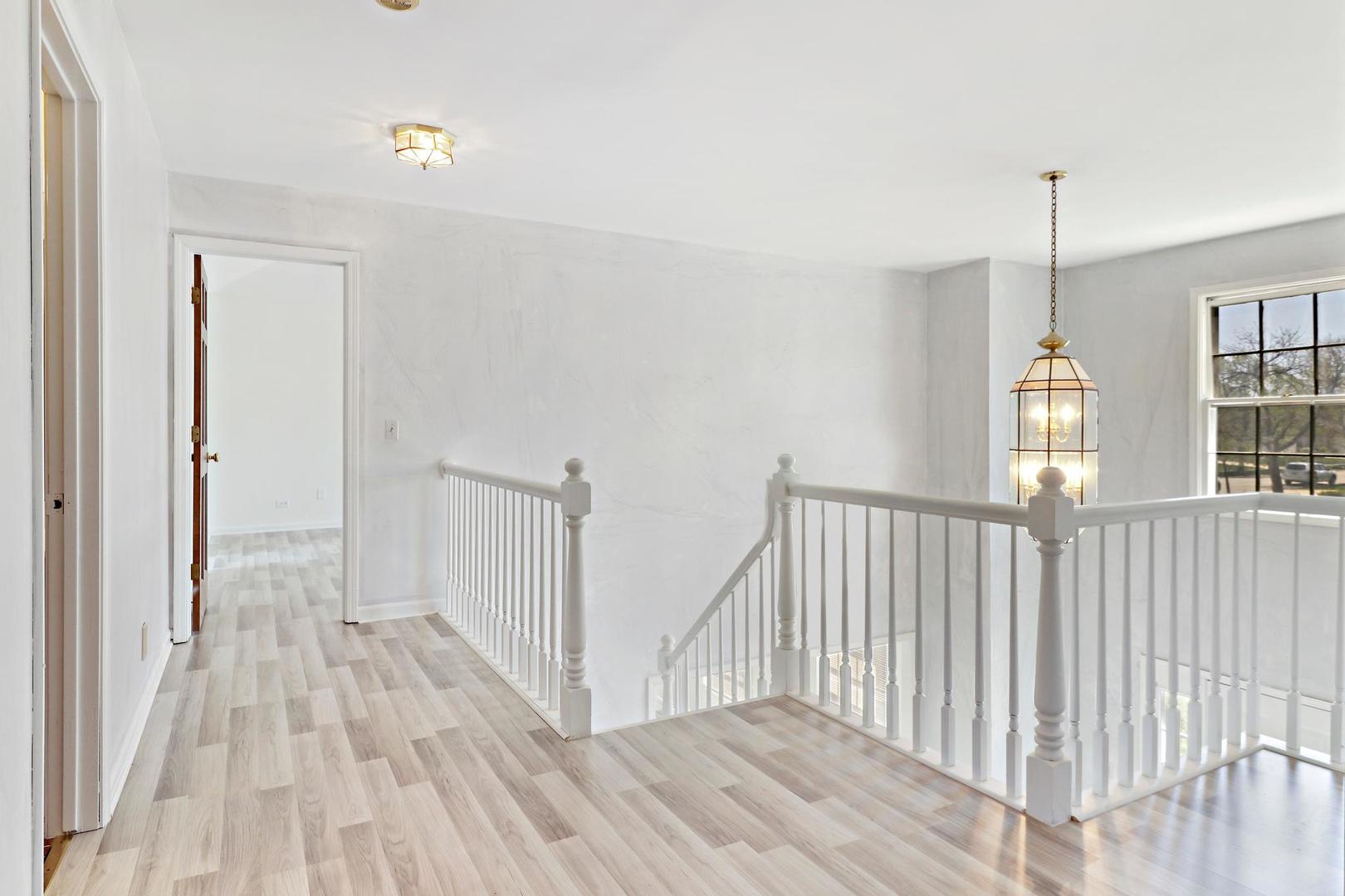 149 West Schick Road Bloomingdale, IL 60108 - Photo 24 of 35 a view of hallway with wooden floor