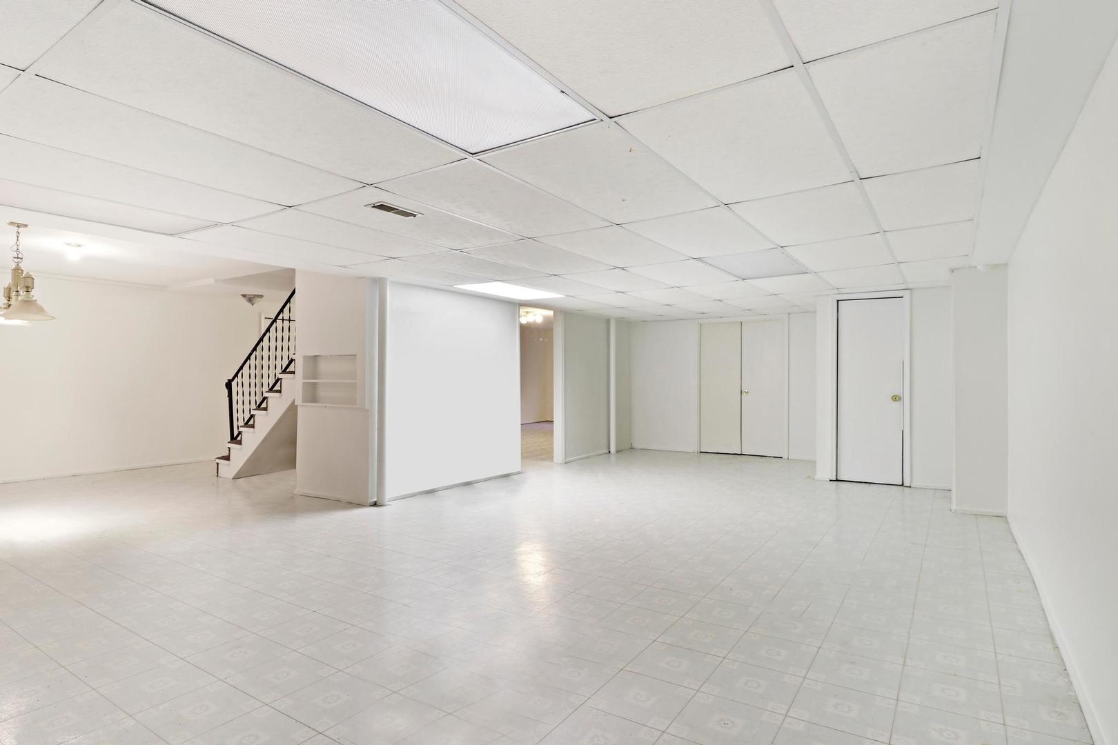 149 West Schick Road Bloomingdale, IL 60108 - Photo 25 of 35 a view of an empty room with stairs