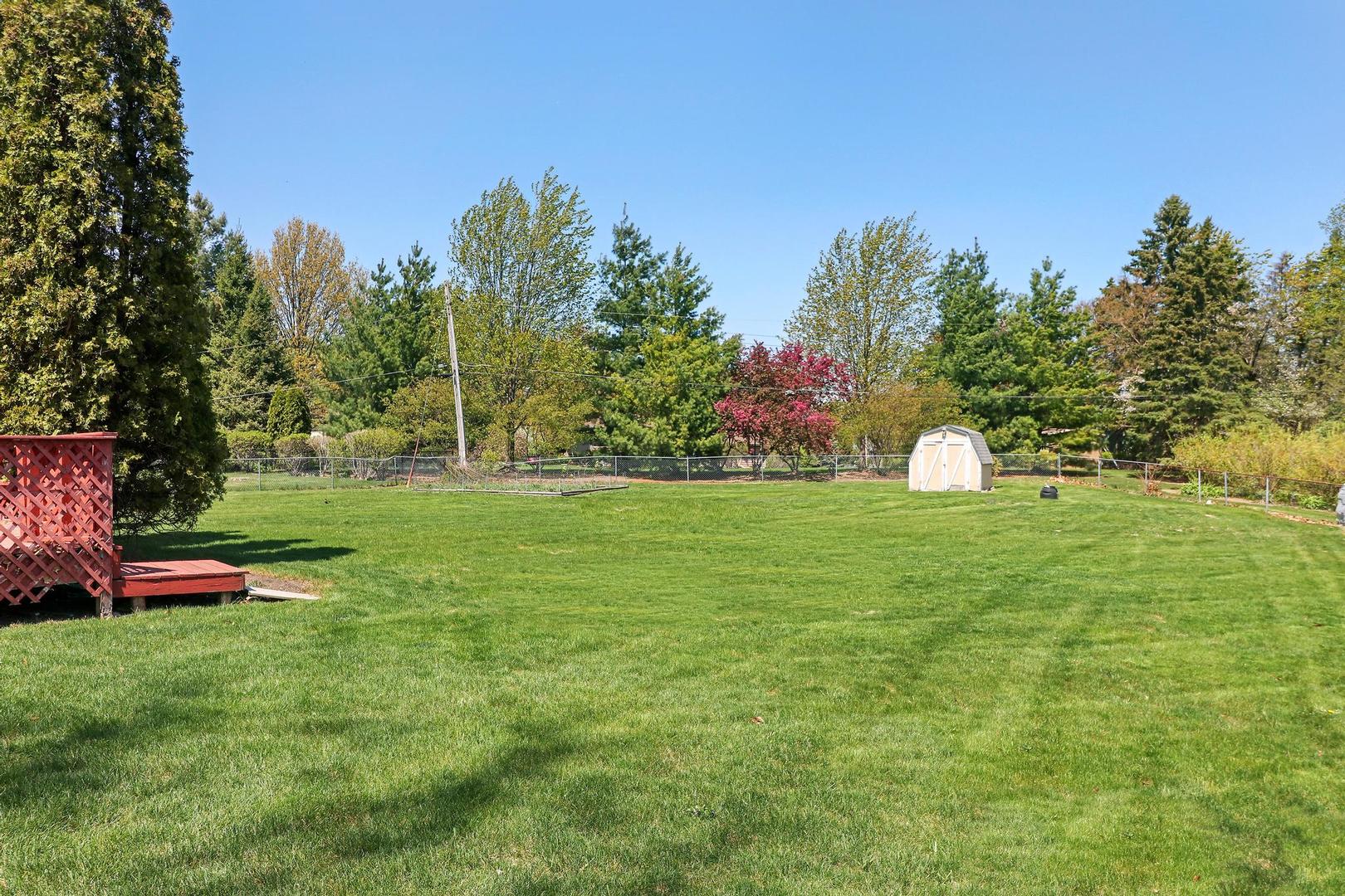 149 West Schick Road Bloomingdale, IL 60108 - Photo 29 of 35 a view of a garden with an outdoor space and seating area