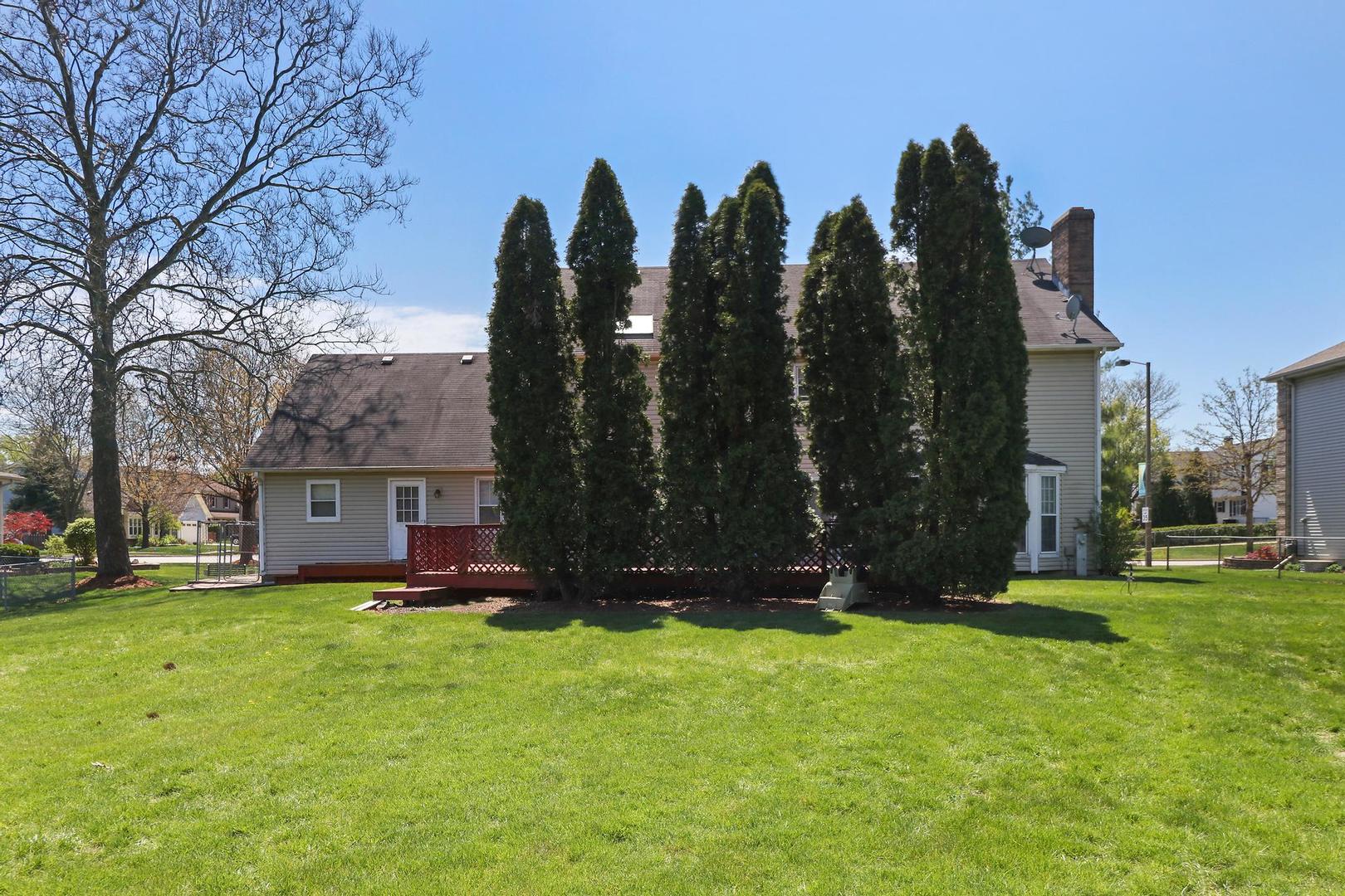 149 West Schick Road Bloomingdale, IL 60108 - Photo 31 of 35 a view of a house with a yard and trees