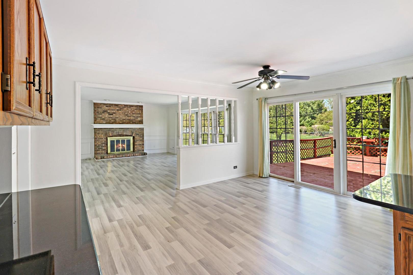 149 West Schick Road Bloomingdale, IL 60108 - Photo 6 of 35 a view of an empty room with wooden floor and a window