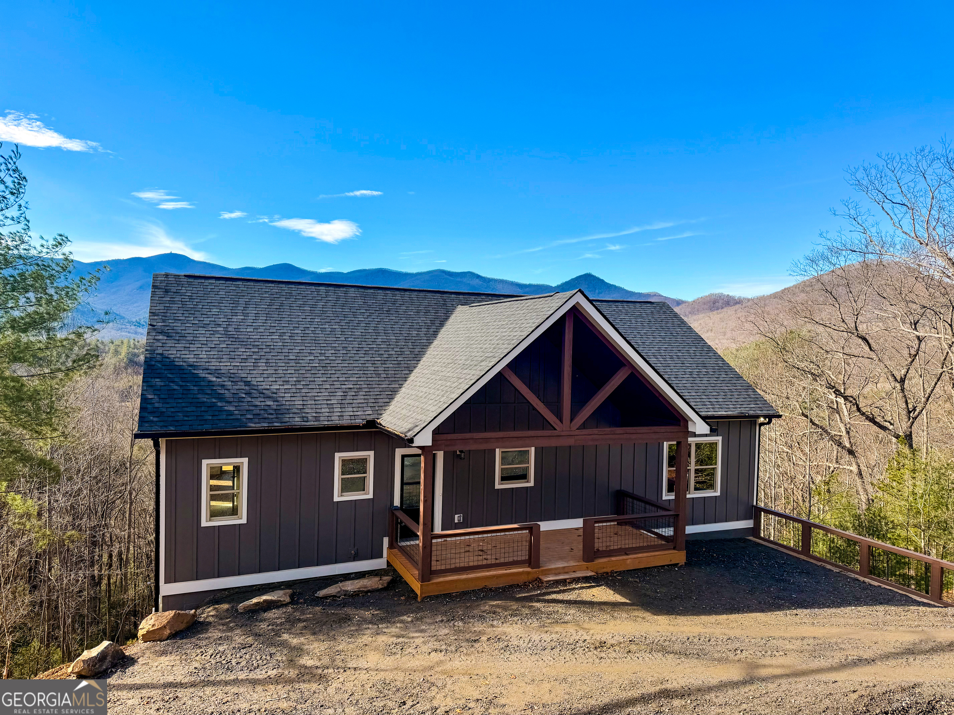 438 Mill Ridge Road Hiawassee, GA 30546 - Photo 3 of 75 a front view of a house with garden