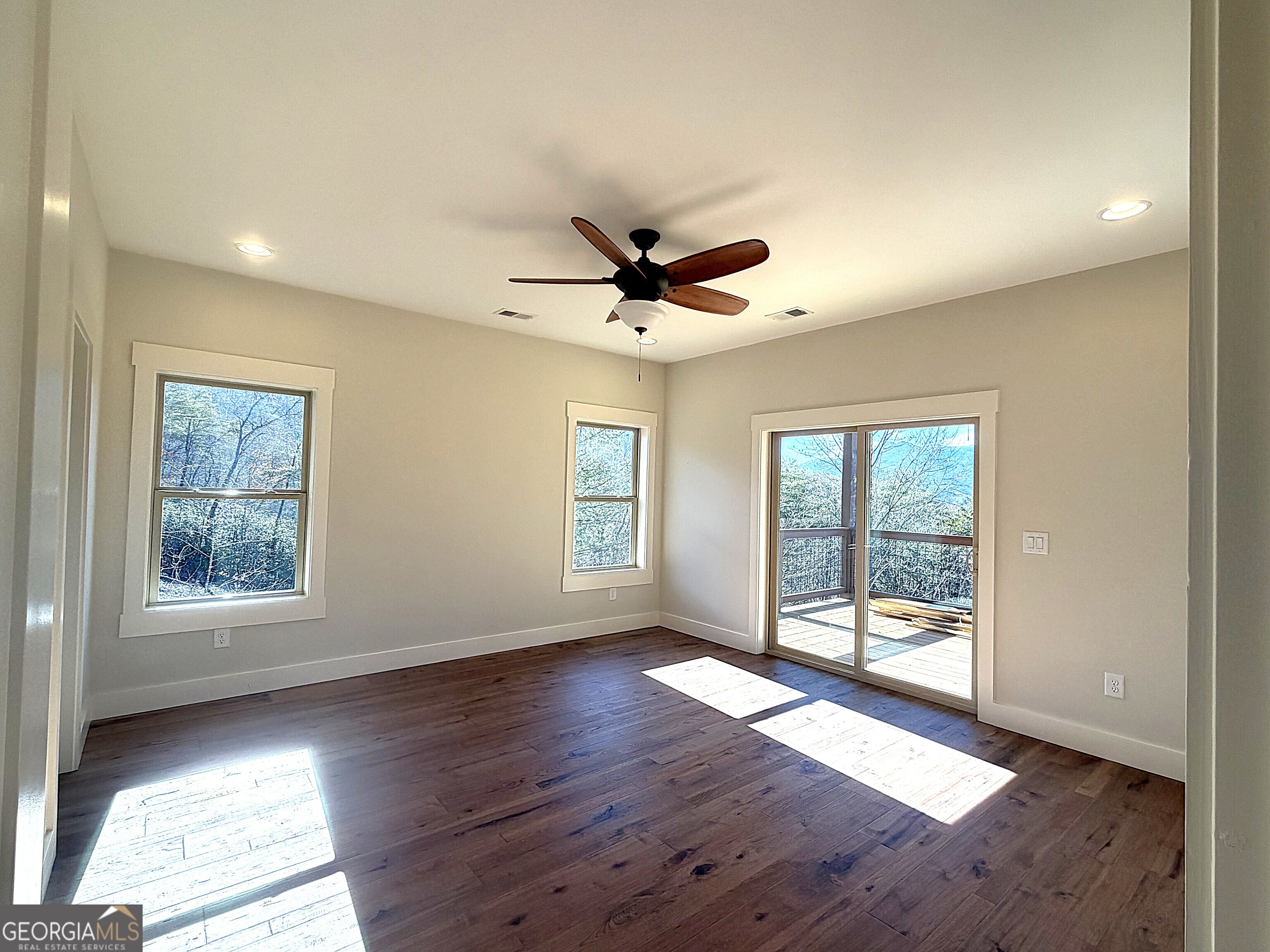 438 Mill Ridge Road Hiawassee, GA 30546 - Photo 9 of 75 wooden floor in an empty room with a window