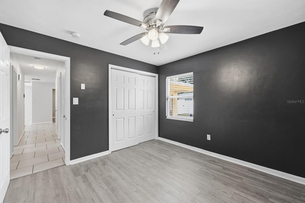 1439 Wilson Road Clearwater, FL 33755 - Photo 19 of 26 wooden floor in an empty room with a window
