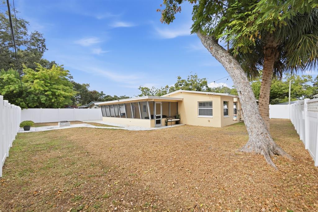 1439 Wilson Road Clearwater, FL 33755 - Photo 23 of 26 a view of an house with backyard space and garden
