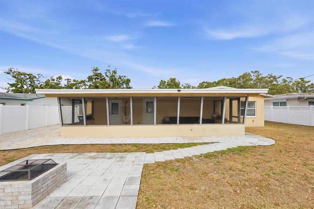 1439 Wilson Road Clearwater, FL 33755 - Photo 24 of 26 a front view of a house with a yard