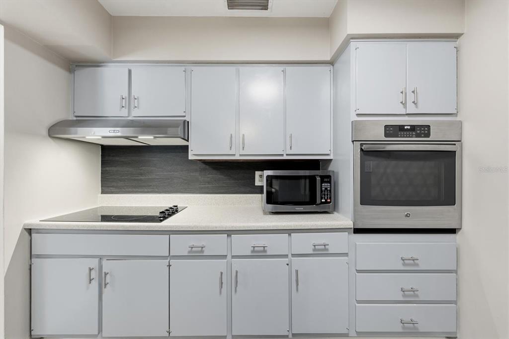 1439 Wilson Road Clearwater, FL 33755 - Photo 7 of 26 a kitchen with appliances cabinets and a sink