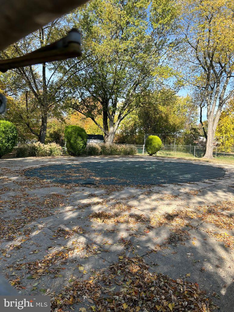 4701 Pennell Road, Unit J11 Aston, PA 19014 - Photo 15 of 18 a view of a yard with yellow lighting
