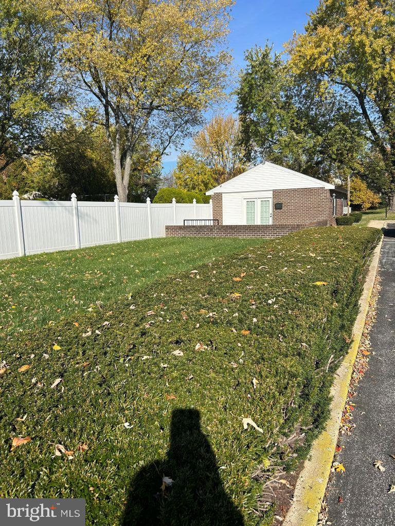 4701 Pennell Road, Unit J11 Aston, PA 19014 - Photo 16 of 18 a view of a house with a yard