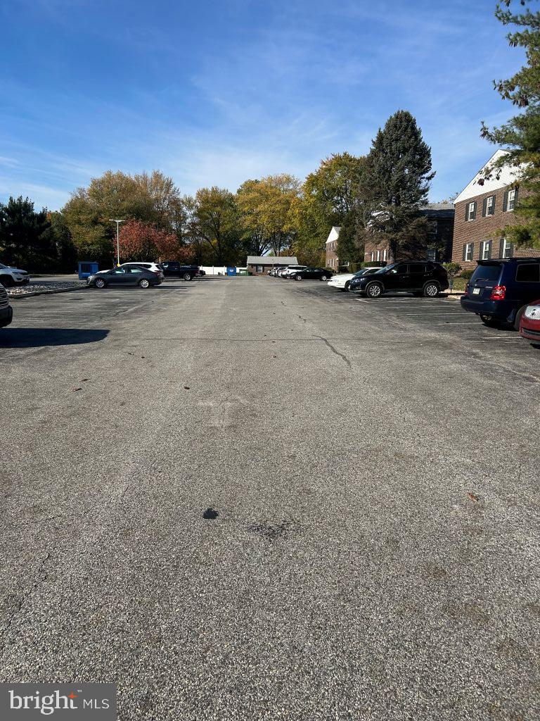 4701 Pennell Road, Unit J11 Aston, PA 19014 - Photo 17 of 18 a view of car parked on road with a road