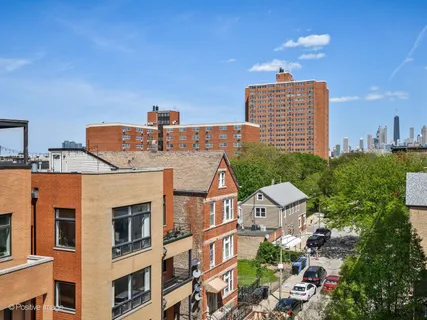 a front view of a residential apartment building with a yard