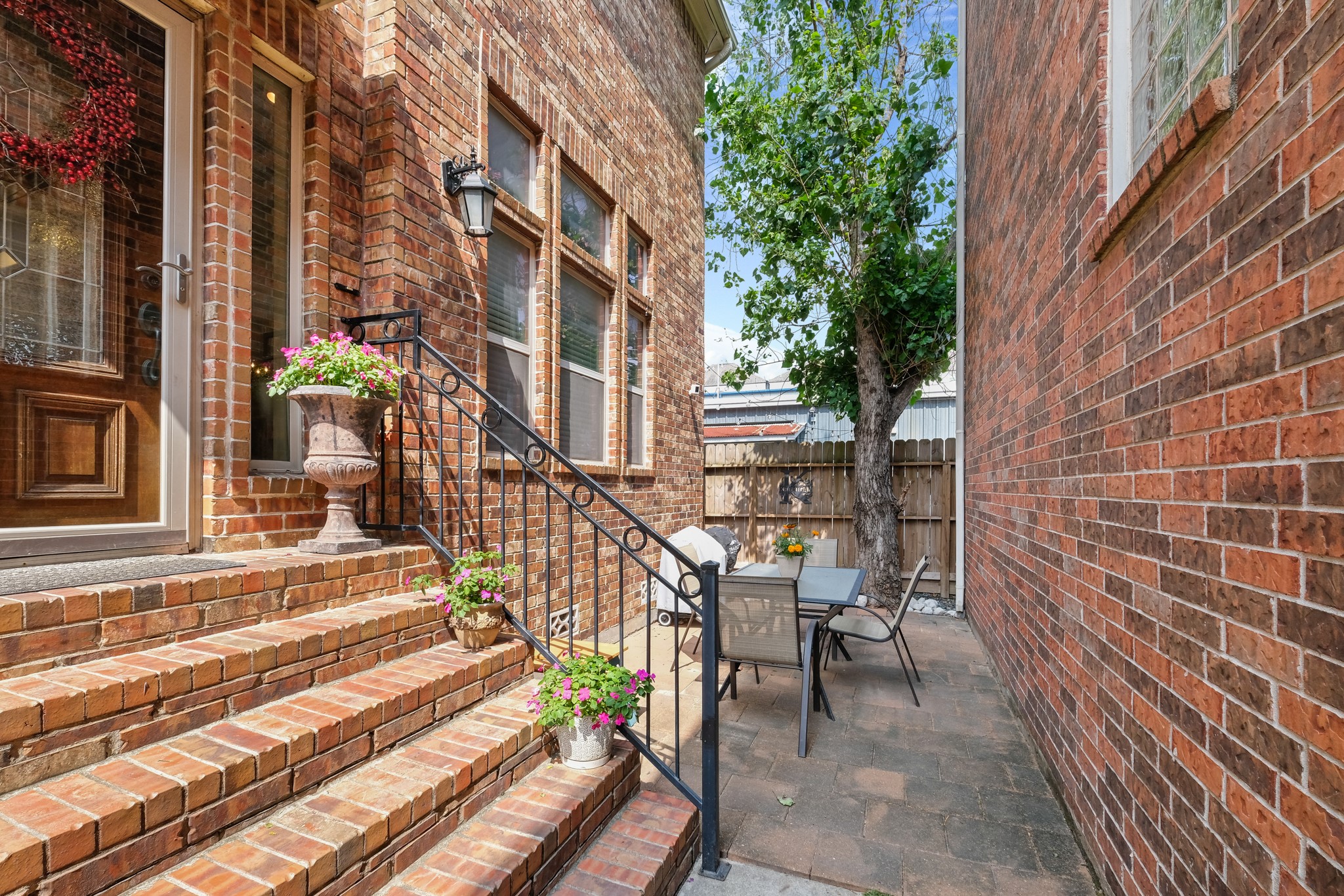933 West 17th Street Houston, TX 77008 - Photo 2 of 19 Charming patio/deck with a board fencing for more privacy.
