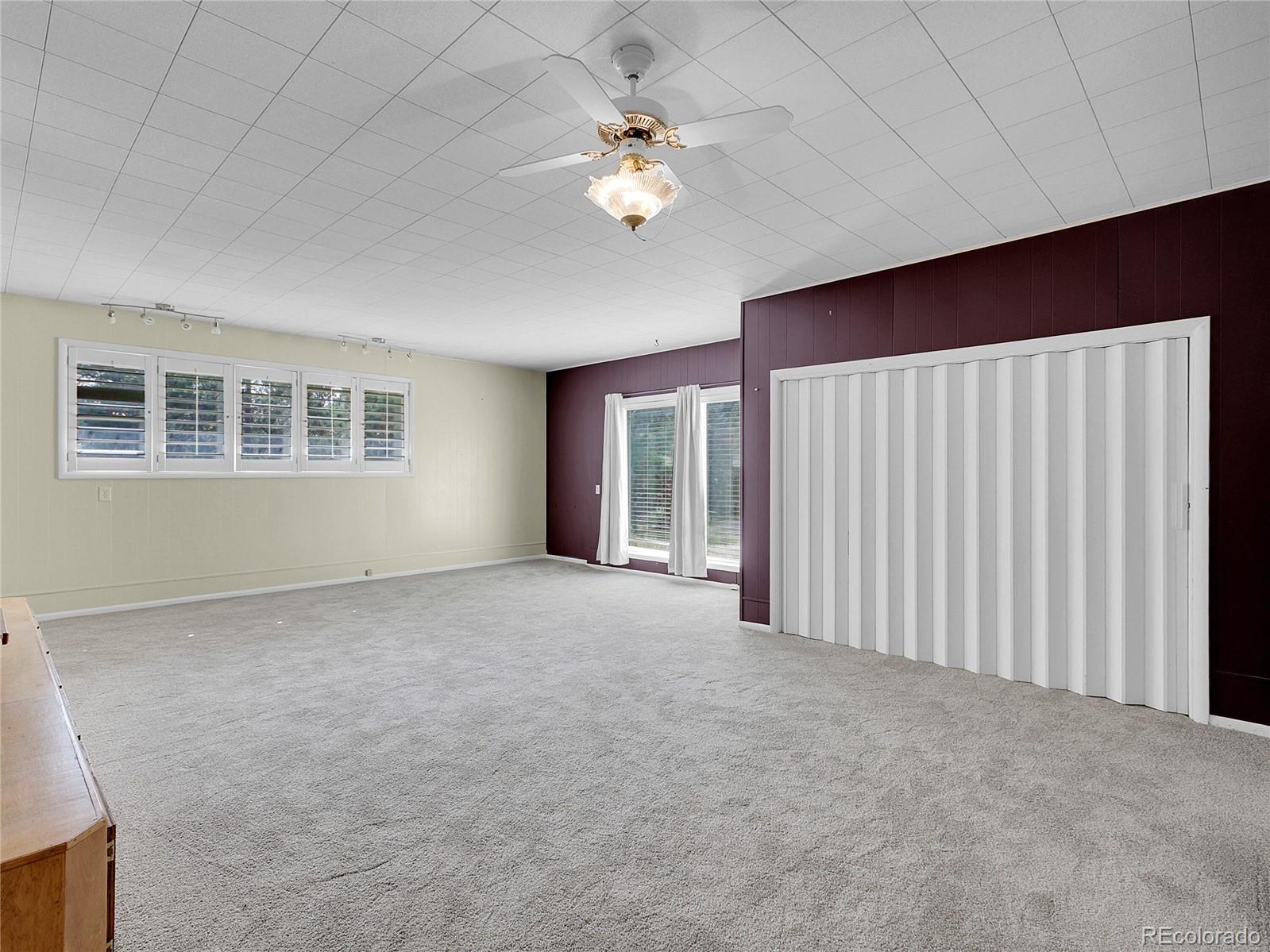 28449 Douglas Park Road Evergreen, CO 80439 - Photo 11 of 25 a view of a livingroom with a ceiling fan and window