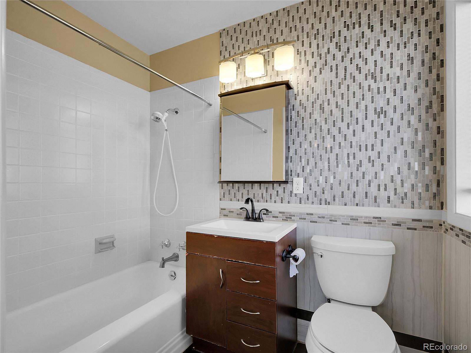 28449 Douglas Park Road Evergreen, CO 80439 - Photo 23 of 25 a bathroom with a toilet sink and mirror