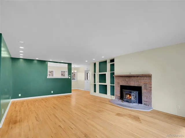 a bedroom with a bed and a fireplace