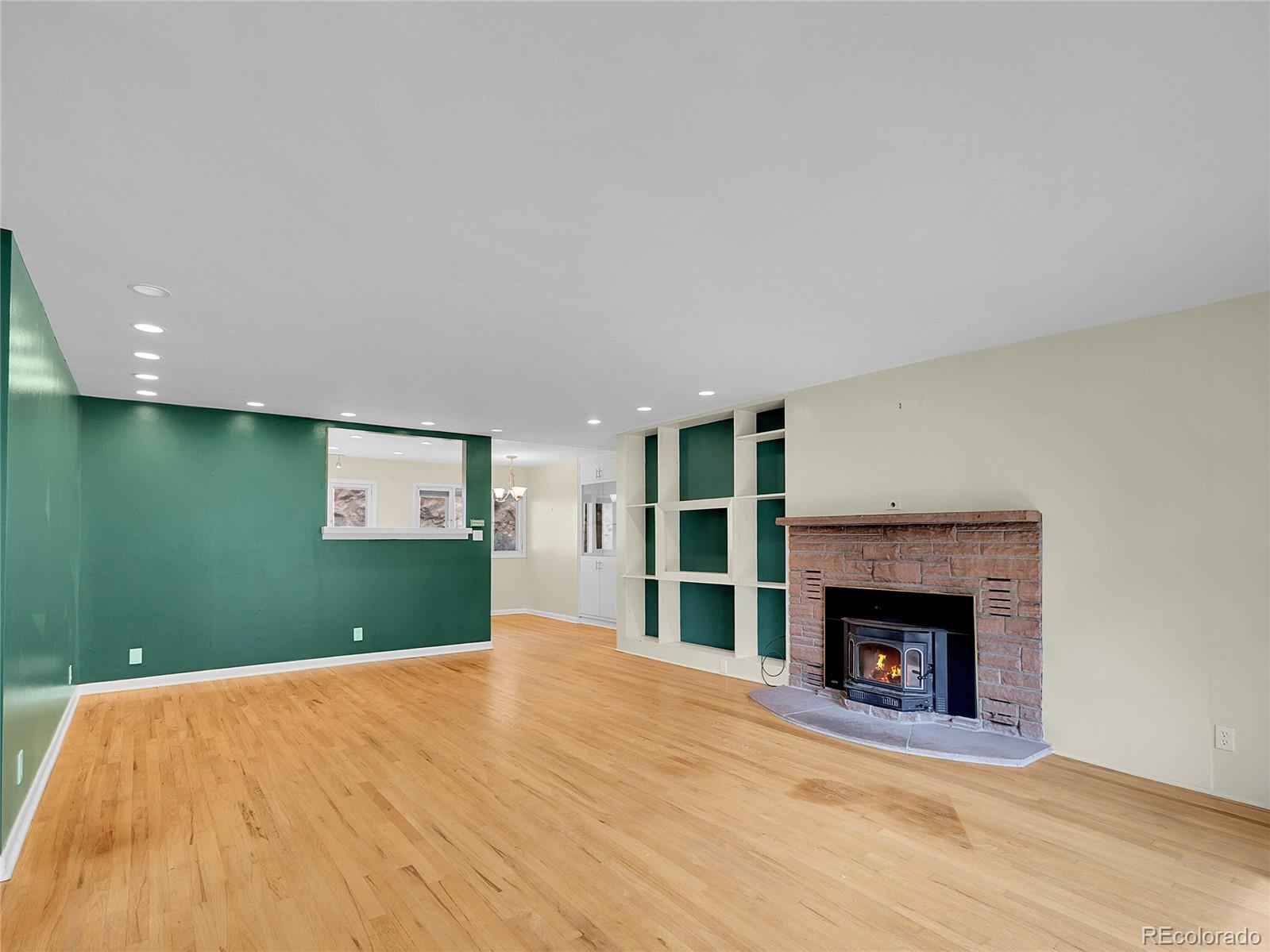 28449 Douglas Park Road Evergreen, CO 80439 - Photo 4 of 25 a bedroom with a bed and a fireplace