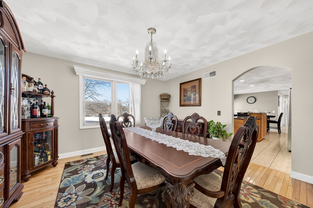 155 Sagamore Road Seekonk, MA 02771 - Photo 14 of 41 a view of a dining room with furniture and wooden floor
