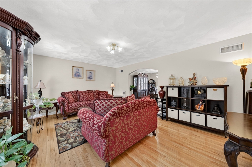 155 Sagamore Road Seekonk, MA 02771 - Photo 15 of 41 a living room with furniture a rug and a book shelf