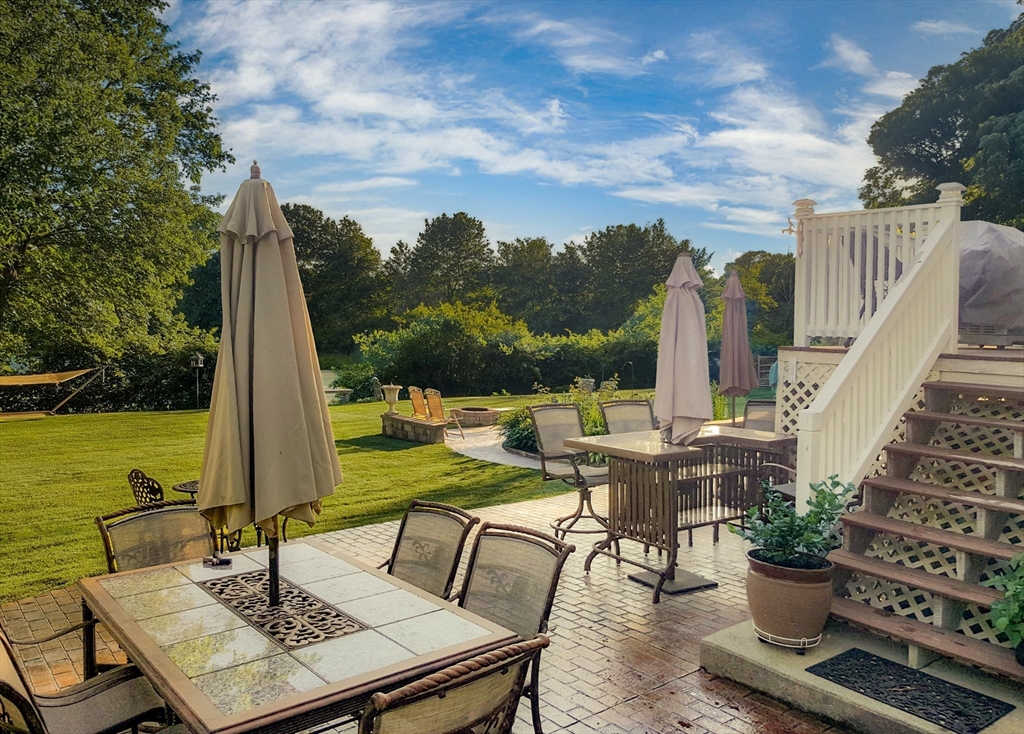 155 Sagamore Road Seekonk, MA 02771 - Photo 39 of 41 a view of a patio with a table chairs and a table