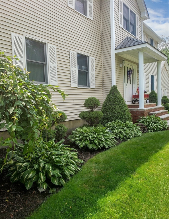 155 Sagamore Road Seekonk, MA 02771 - Photo 41 of 41 a view of a house with a garden and plants