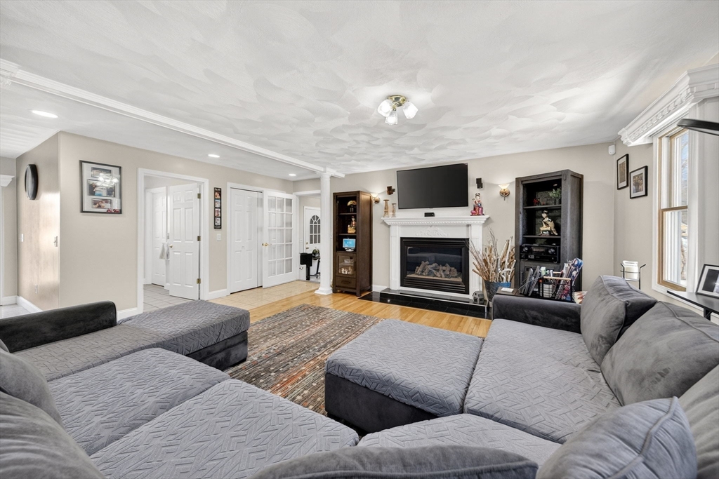 155 Sagamore Road Seekonk, MA 02771 - Photo 8 of 41 a living room with furniture and a fireplace