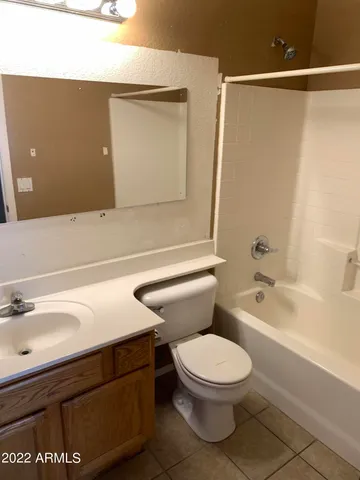 a bathroom with a toilet a sink and bathtub