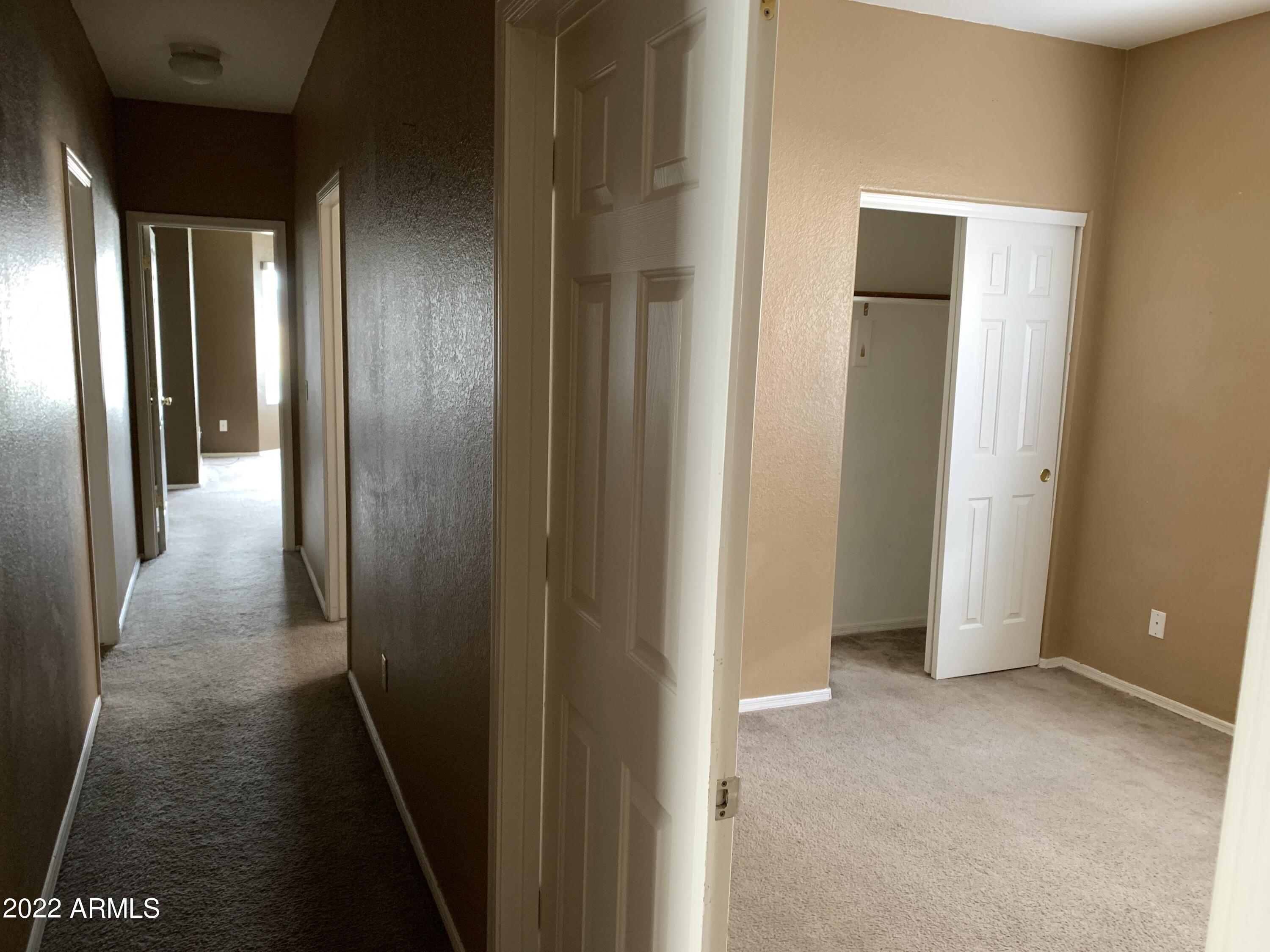 810 South 124th Avenue Avondale, AZ 85323 - Photo 6 of 18 a view of hallway with stairs