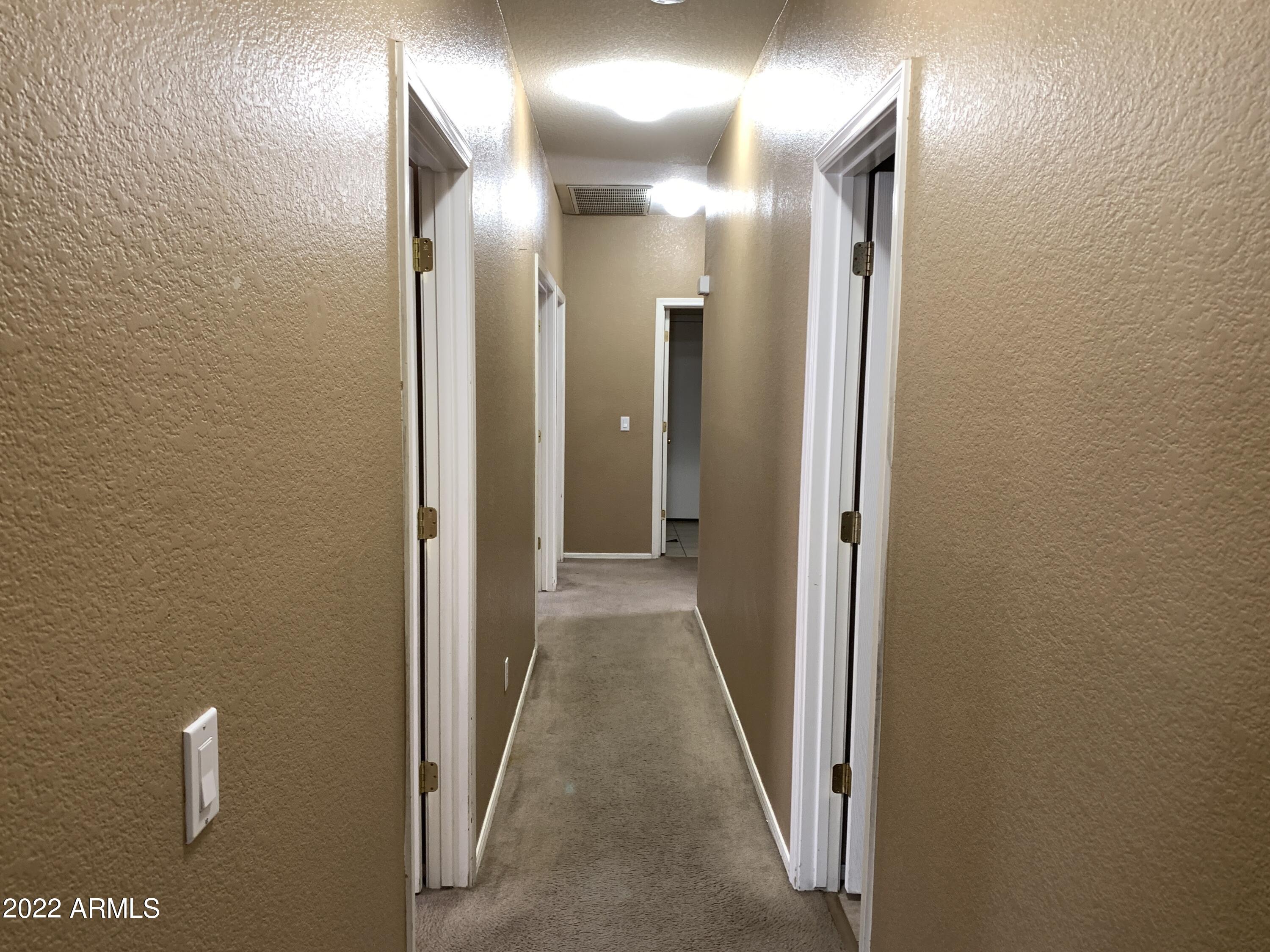 810 South 124th Avenue Avondale, AZ 85323 - Photo 7 of 18 a view of a hallway with a elevator