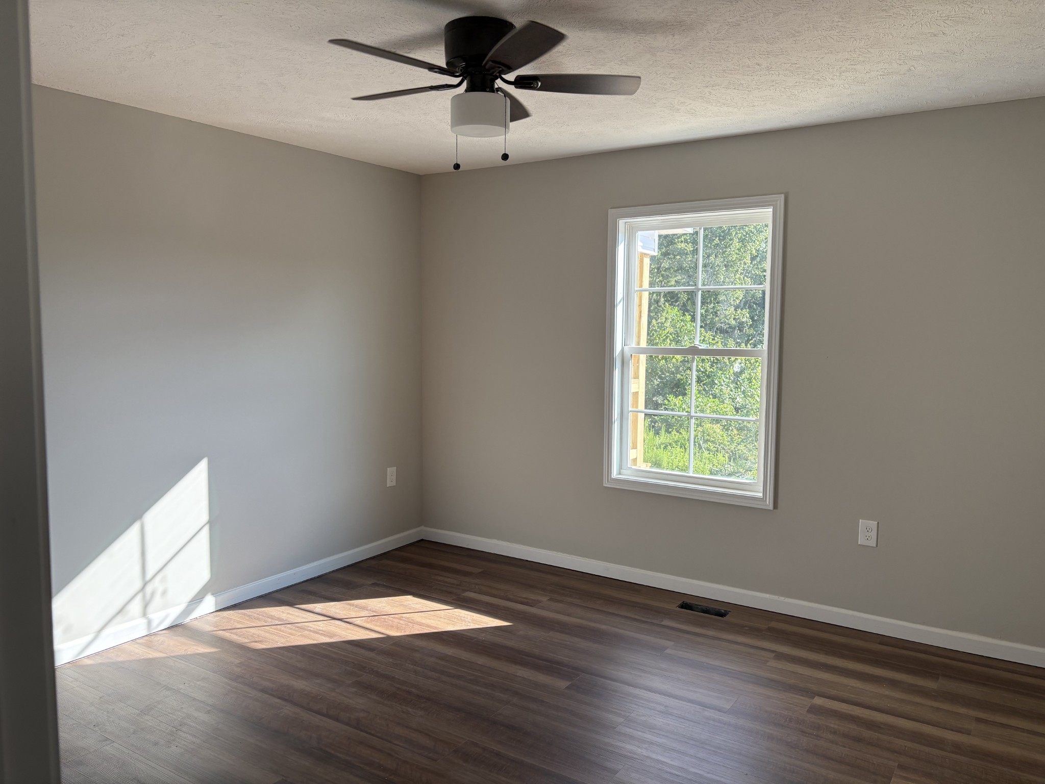 232 Poling Drive Pulaski, TN 38478 - Photo 21 of 24 a view of empty room with wooden floor and fan