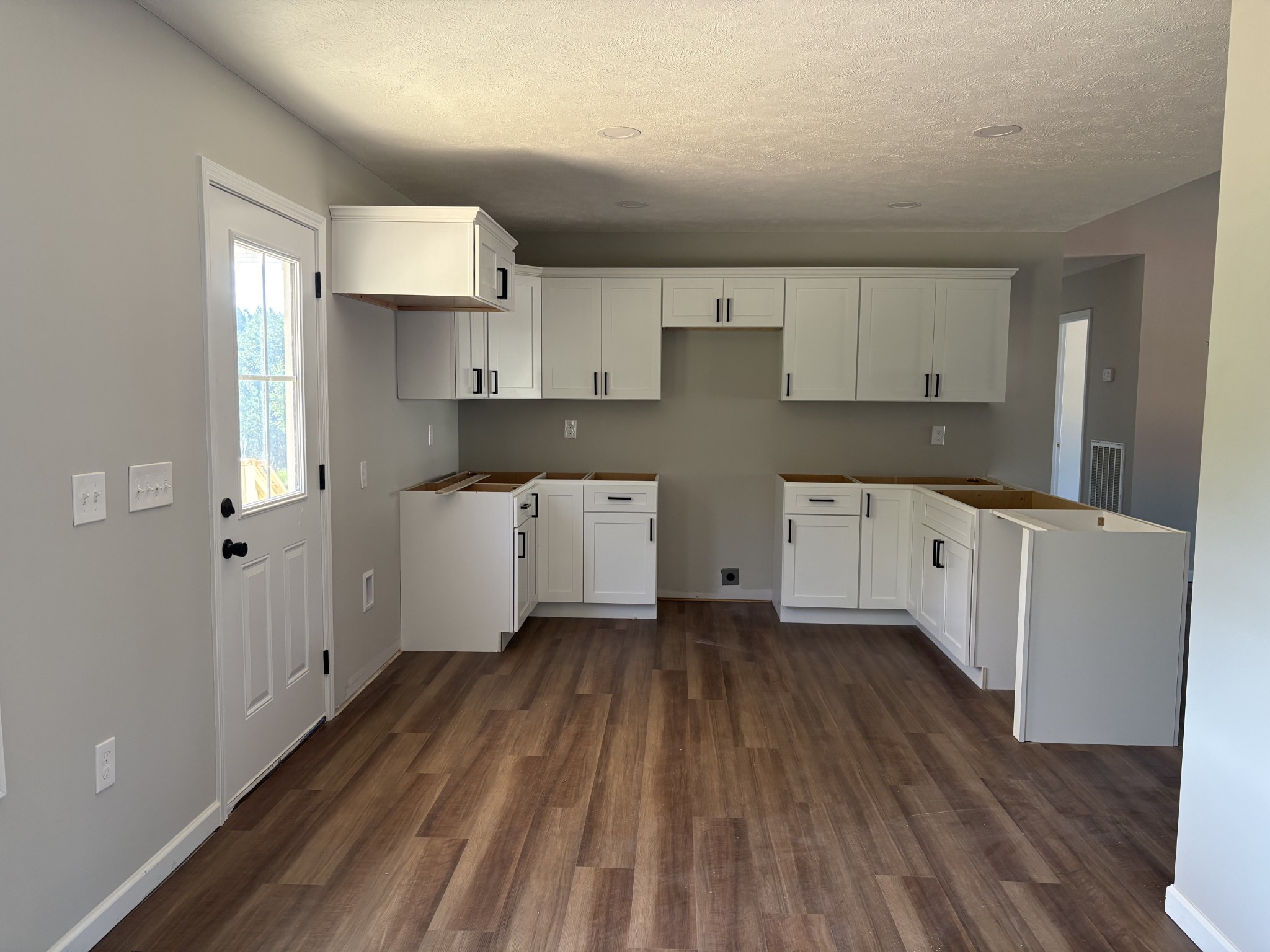 232 Poling Drive Pulaski, TN 38478 - Photo 22 of 24 a kitchen with cabinets a sink and wooden floor