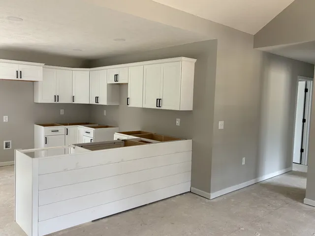 a room with a bed and a cabinets