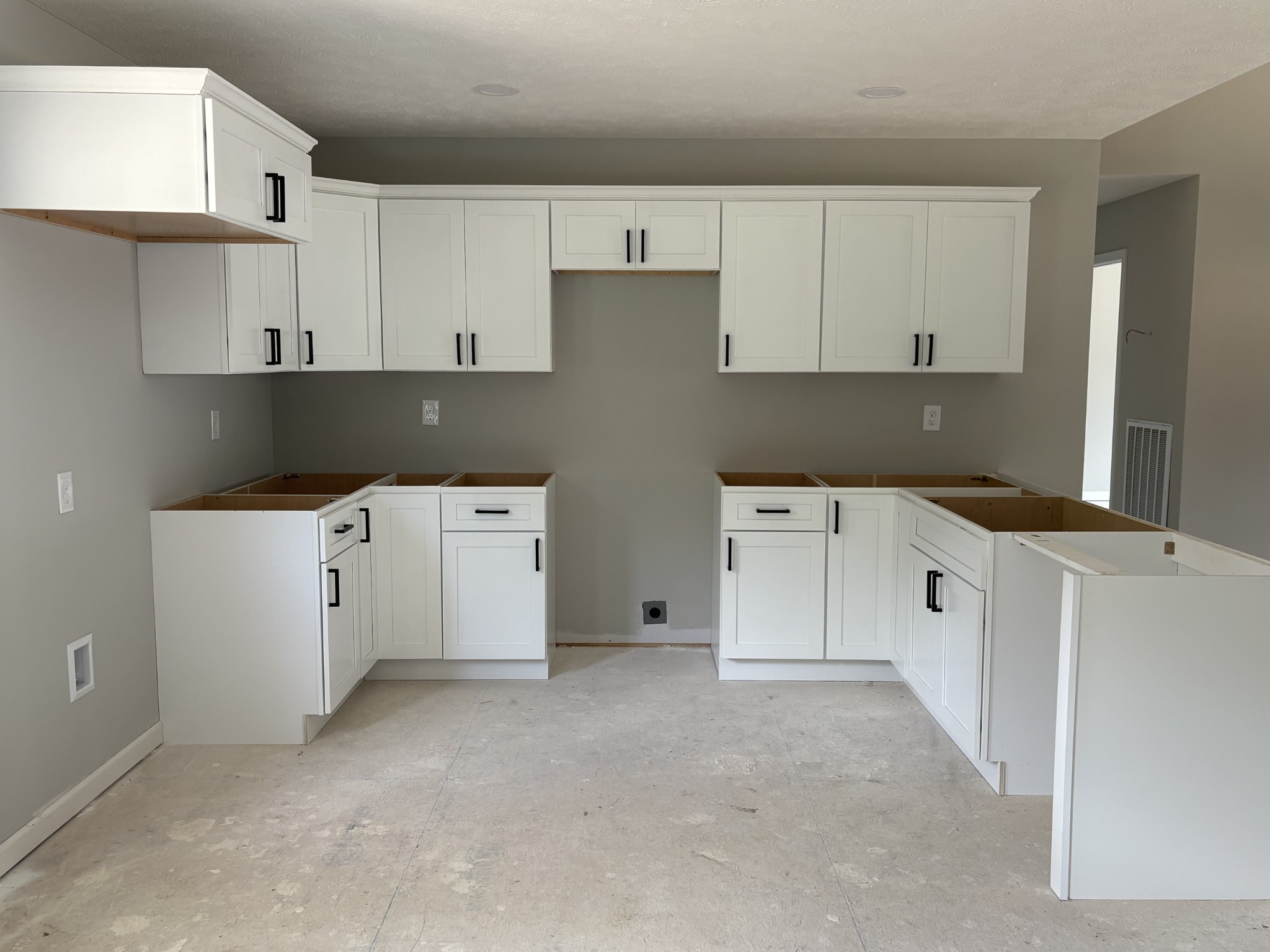 232 Poling Drive Pulaski, TN 38478 - Photo 4 of 24 a kitchen with cabinets and white appliances