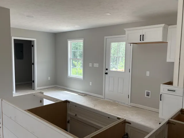a kitchen with a sink and a window