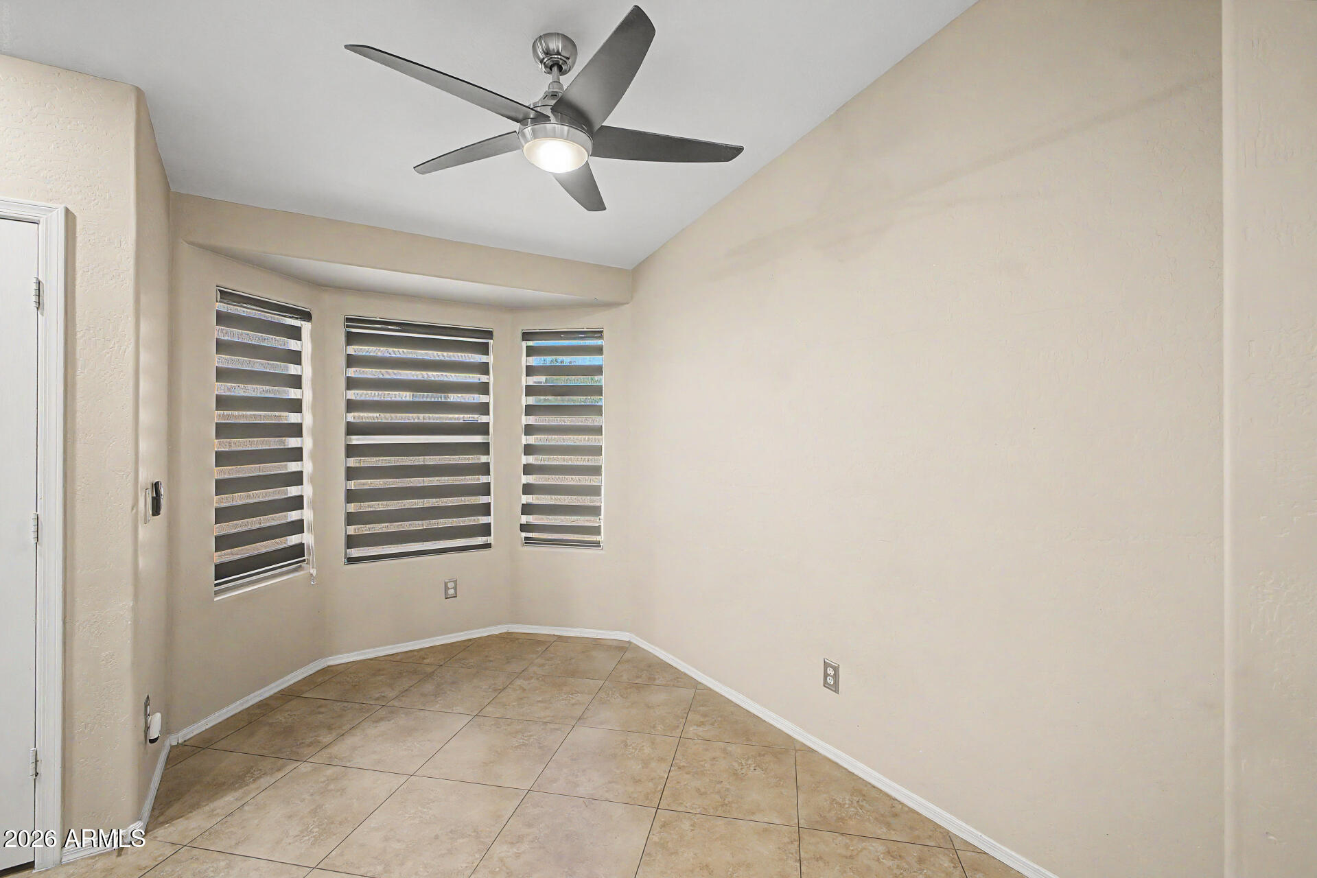 2340 West Apollo Road Phoenix, AZ 85041 - Photo 10 of 26 a view of empty room with windows