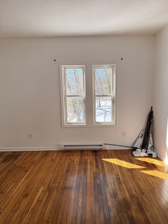 1442 Main Street, Unit 3 Worcester, MA 01603 - Photo 7 of 9 a view of a room with wooden floor and a window
