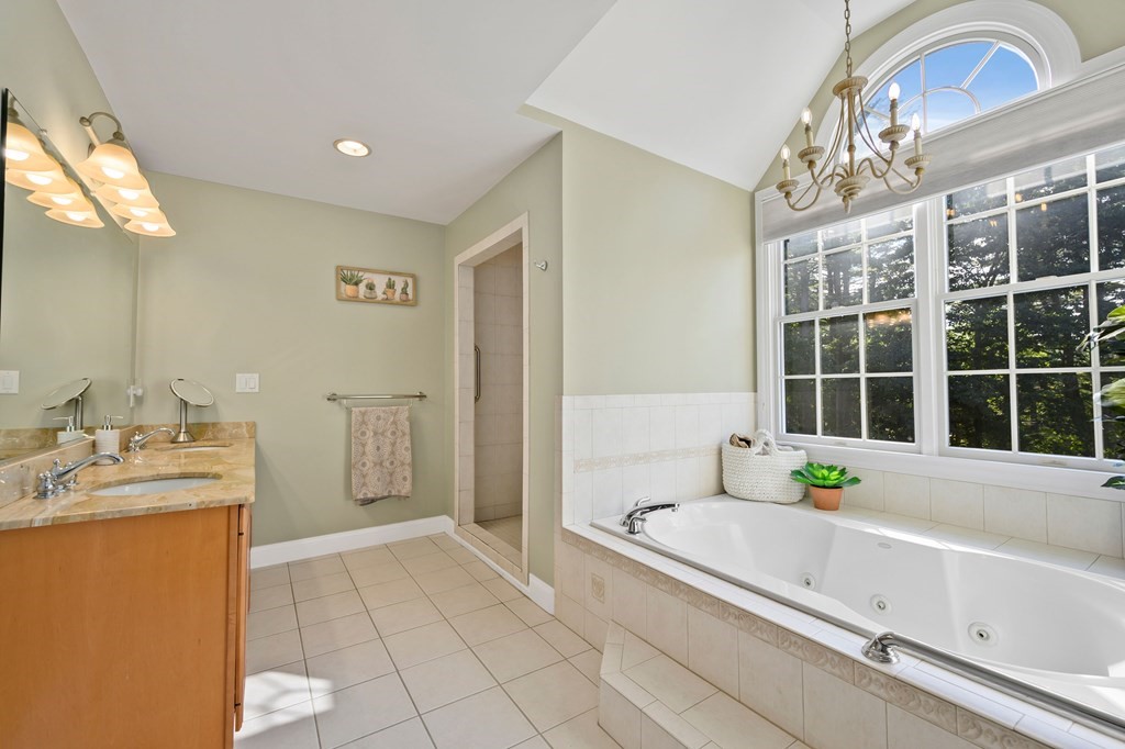 182 Boston Street Middleton, MA 01949 - Photo 35 of 42 a bathroom with a tub sink and mirror
