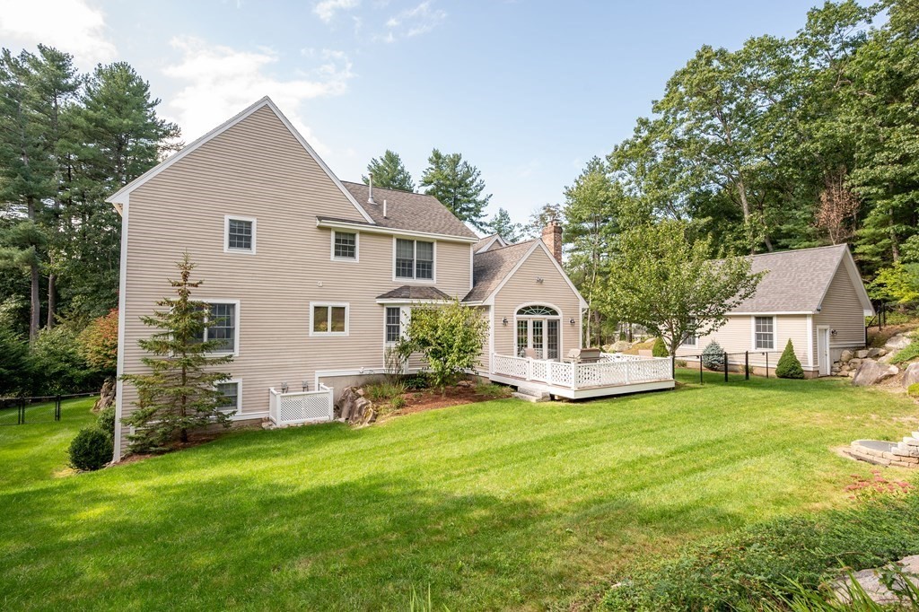 182 Boston Street Middleton, MA 01949 - Photo 8 of 42 a view of a house with a yard and sitting area