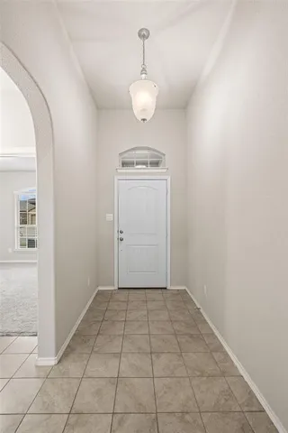 a view of a room with an empty space and a sink