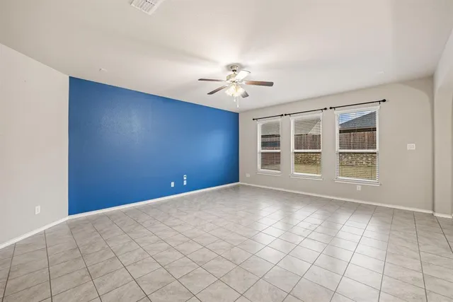 a view of kitchen with stainless steel appliances cabinets and window