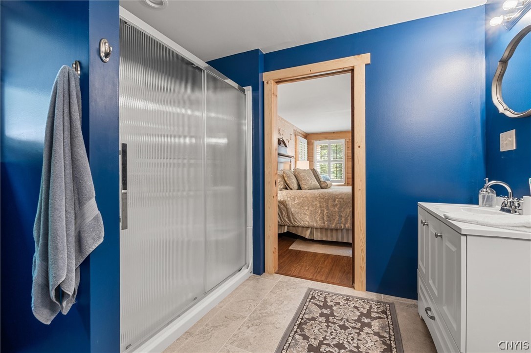 9831 Steam Mill Road Camden, NY 13316 - Photo 25 of 42 Primary bathroom leading directly into the spaciou