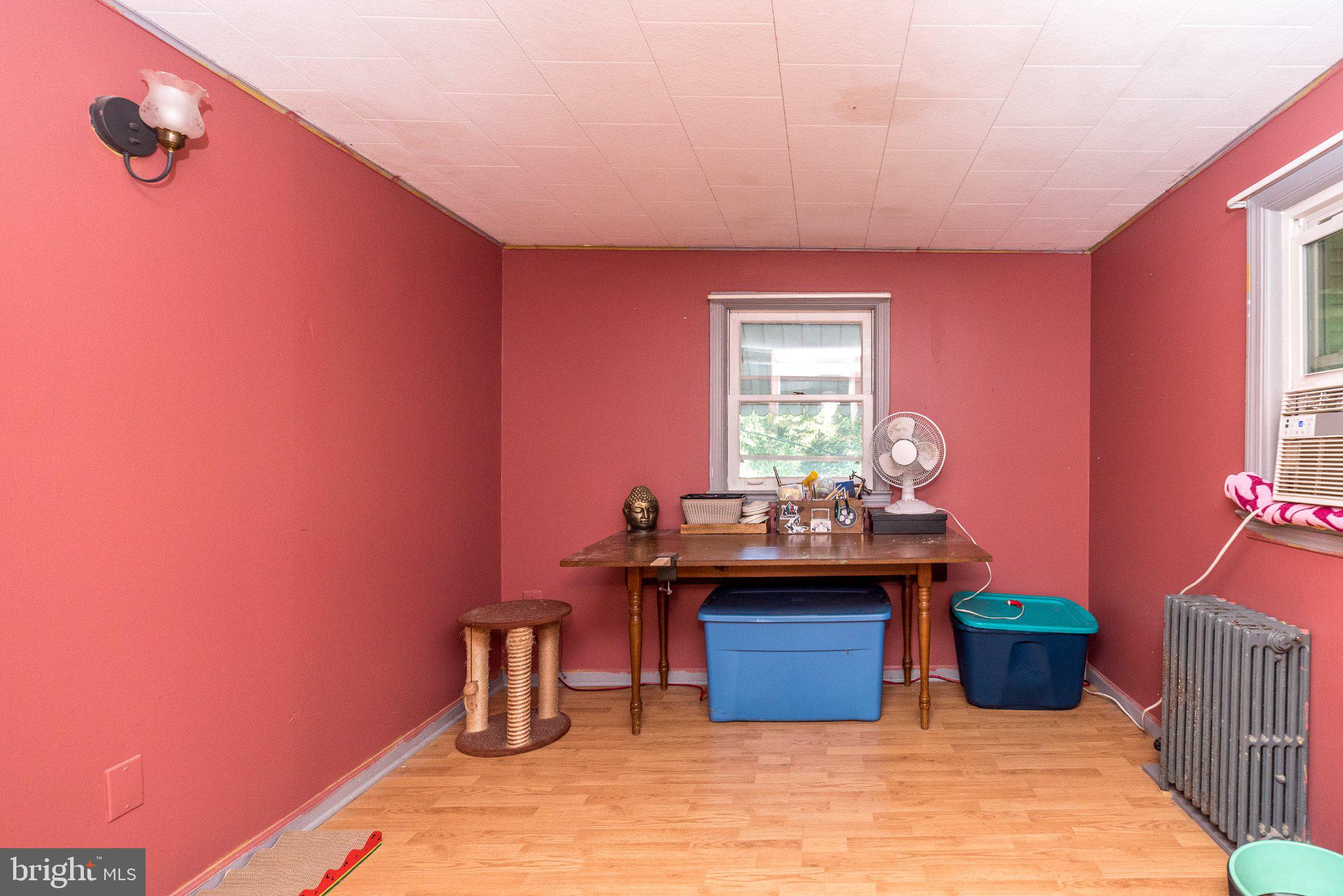 109 Ridge Street Reading, PA 19607 - Photo 30 of 41 Cozy room with warm red walls.