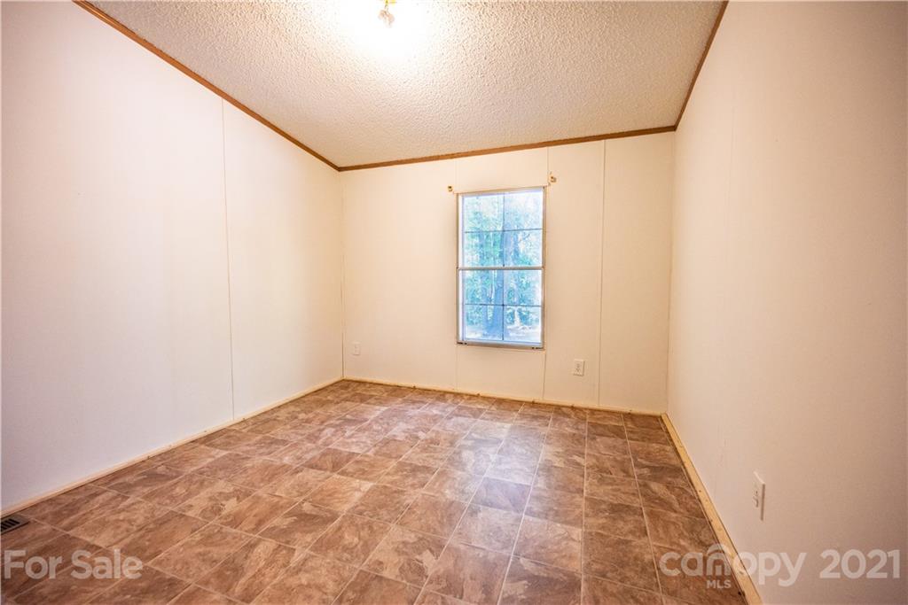 6550 Lewis Road Kings Mountain, NC 28086 - Photo 12 of 20 an empty room with windows