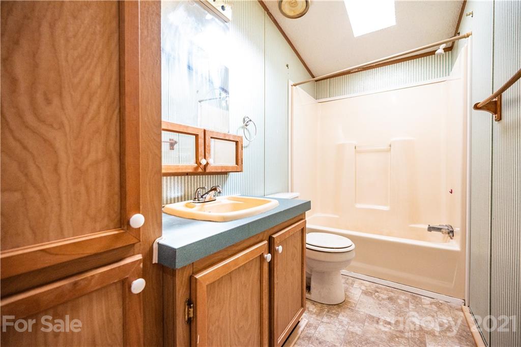 6550 Lewis Road Kings Mountain, NC 28086 - Photo 15 of 20 a bathroom with a sink a toilet and shower
