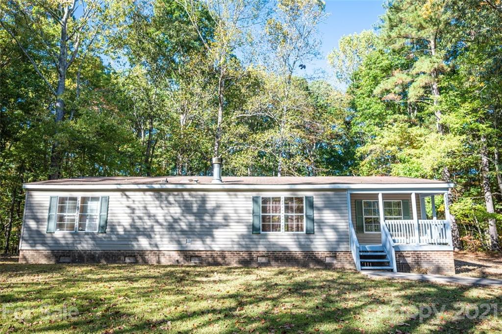 6550 Lewis Road Kings Mountain, NC 28086 - Photo 18 of 20 a view of house with swimming pool and yard