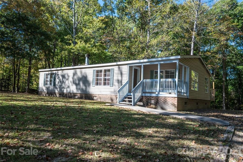 6550 Lewis Road Kings Mountain, NC 28086 - Photo 3 of 20 a view of a house with backyard and sitting area