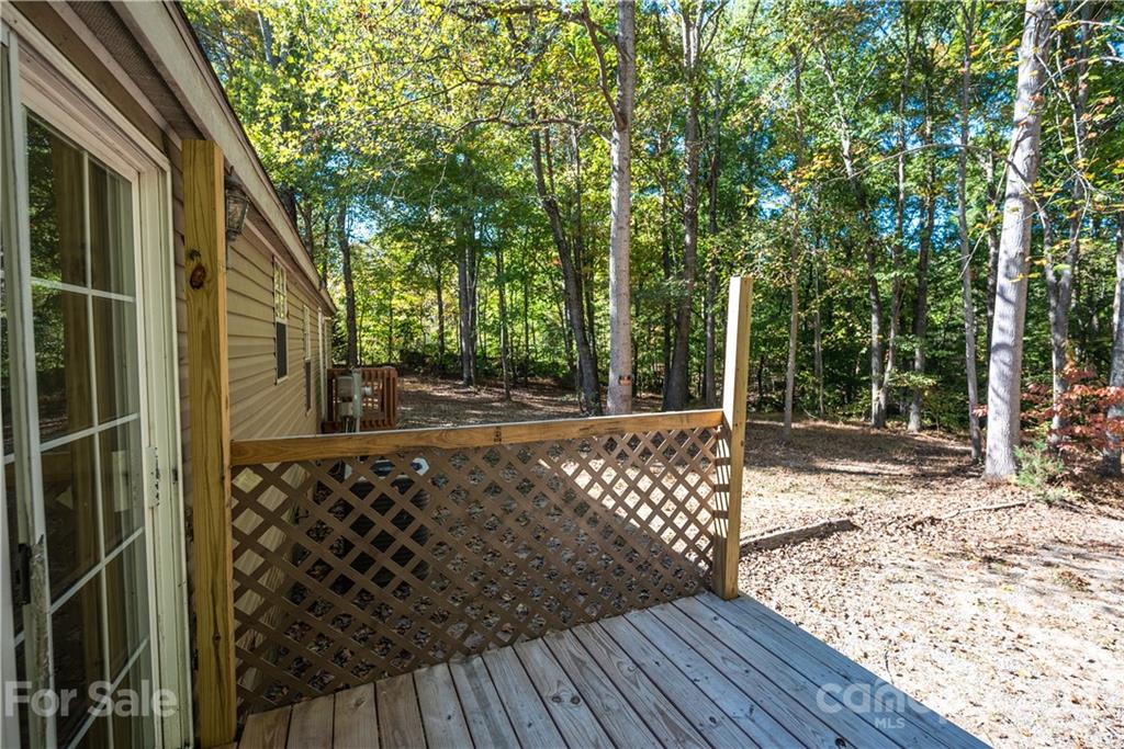 6550 Lewis Road Kings Mountain, NC 28086 - Photo 5 of 20 a view of a pathway with a wooden deck