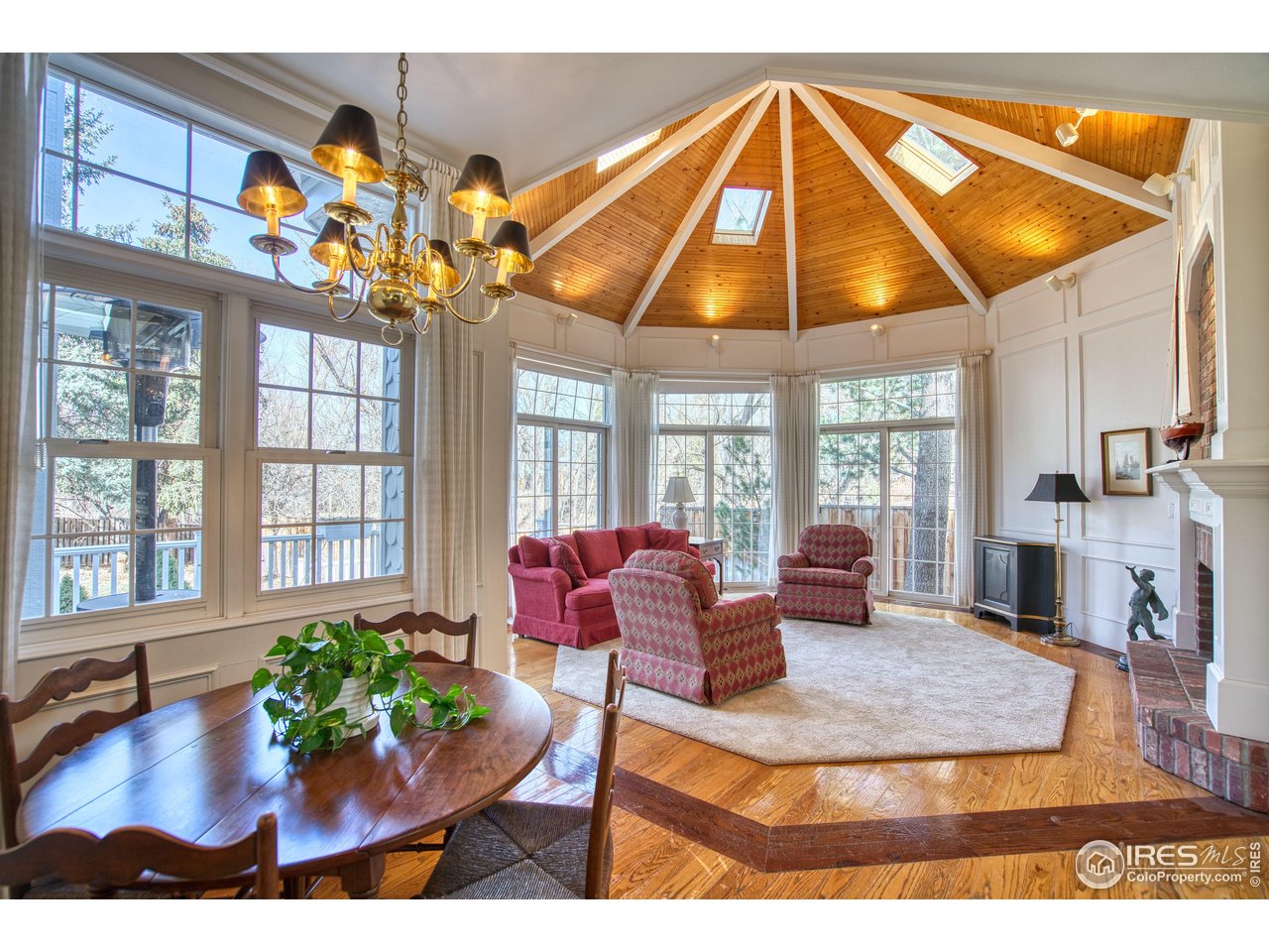 4471 Wellington Road Boulder, CO 80301 - Photo 11 of 42 a living room with fireplace furniture and a potted plant