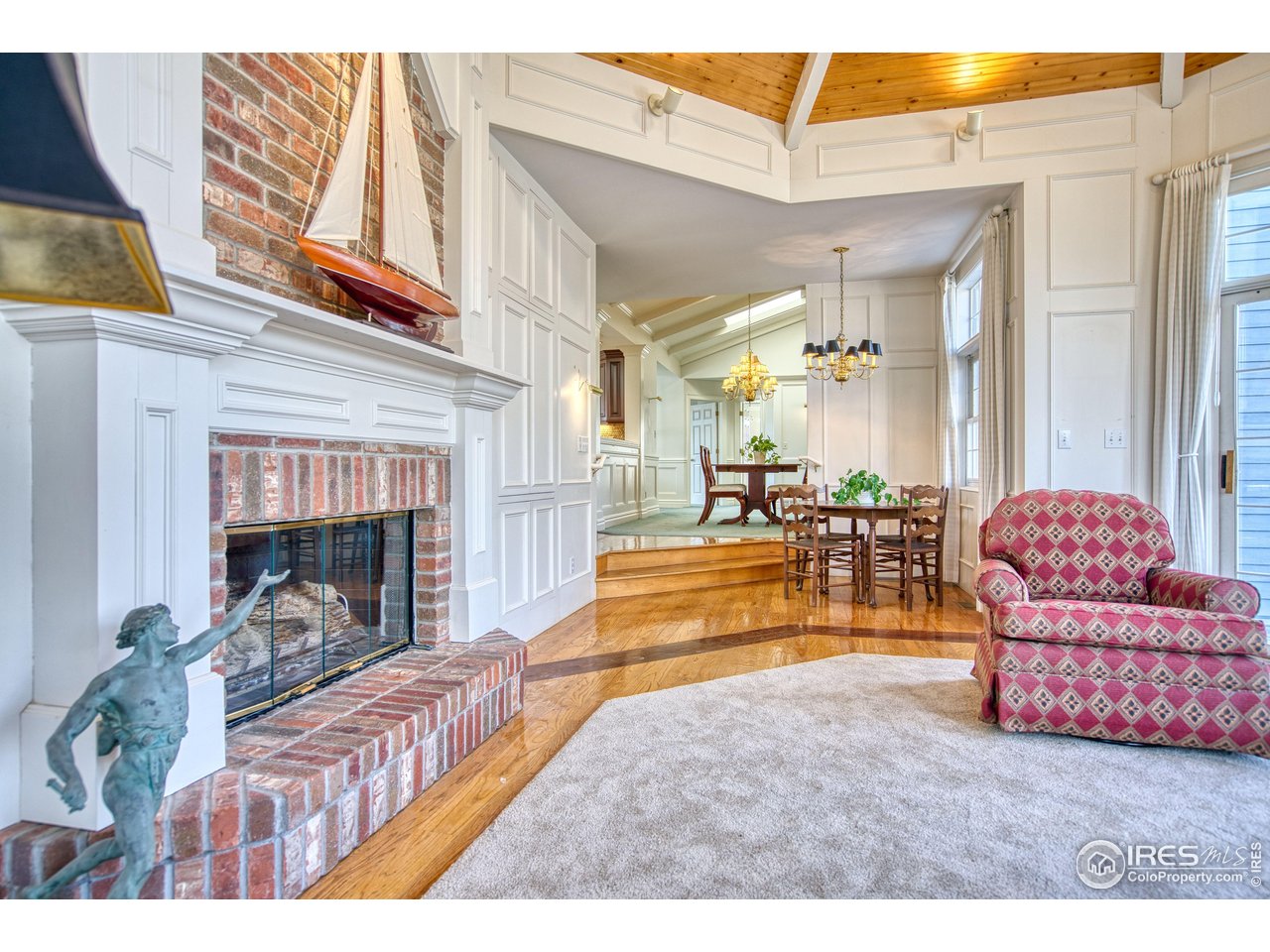 4471 Wellington Road Boulder, CO 80301 - Photo 13 of 42 a living room with furniture and a fireplace